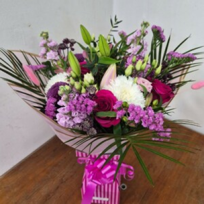 Raspberry Delight  - Beautiful arrangement of cerise and pink flowers arranged in a pink bouquet box in water 